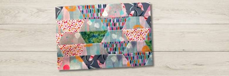 Scrappy half square hexagon quilt